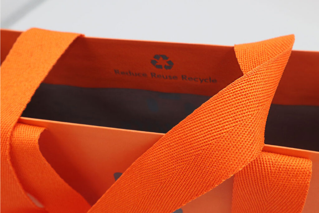 Paper bag with herringbone handles