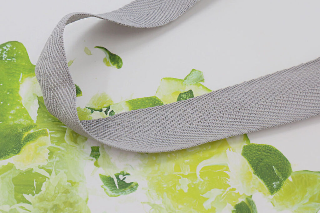 Paper bag with herringbone handles